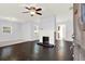 Spacious living room features dark hardwood floors and a cozy fireplace at 2505 Mellville Ave, Decatur, GA 30032