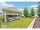 Spacious backyard with enclosed patio, lush lawn, and well-maintained landscaping and perimeter fence at 332 Rosshandler Rd, Suwanee, GA 30024