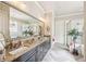 Elegant bathroom featuring a large mirror, dual vanities, and a separate shower with a glass door at 332 Rosshandler Rd, Suwanee, GA 30024