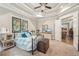 Bedroom with decorative ceiling, stained glass window, and neutral carpet at 332 Rosshandler Rd, Suwanee, GA 30024