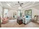 Bedroom with decorative ceiling, stained glass window, and neutral carpet at 332 Rosshandler Rd, Suwanee, GA 30024