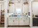 Butler's pantry features marble countertops and white cabinets at 332 Rosshandler Rd, Suwanee, GA 30024