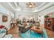 Elegant living room with tray ceilings, plantation shutters, and hardwood floors at 332 Rosshandler Rd, Suwanee, GA 30024
