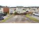 A concrete parking area at the rear of the property is bordered by fenced yards and grass strips at 4713 Liberty Square Dr, Acworth, GA 30101