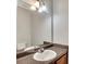 Powder room featuring a vanity with a large mirror and modern faucet at 4713 Liberty Square Dr, Acworth, GA 30101