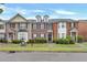 Well-maintained townhomes with brick facades, lush greenery, and appealing curb appeal at 4713 Liberty Square Dr, Acworth, GA 30101
