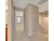 Upstairs hallway with neutral carpeting and view of a sunlit room at 4713 Liberty Square Dr, Acworth, GA 30101