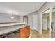 Traditional kitchen with wooden cabinets, double sink, tile floor, and stainless steel dishwasher at 4713 Liberty Square Dr, Acworth, GA 30101