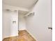 Bright, functional laundry room with shelving, tile flooring, and access door at 4713 Liberty Square Dr, Acworth, GA 30101