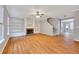 Open-concept living area features hardwood floors, a fireplace, and staircase at 4713 Liberty Square Dr, Acworth, GA 30101