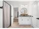 Bathroom vanity with mirror, modern fixtures, and granite countertops at 5745 Westwood Dr, Cumming, GA 30040