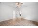 Neutral bedroom featuring wood-look floors and a ceiling fan at 5745 Westwood Dr, Cumming, GA 30040