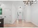 Open entryway with wood-look floors and a modern light fixture at 5745 Westwood Dr, Cumming, GA 30040