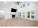 Spacious living room with fireplace and access to outdoor living space at 5745 Westwood Dr, Cumming, GA 30040