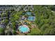 Aerial view of community amenities including pool, tennis courts, and playground at 1003 Dunedin Trl, Woodstock, GA 30188
