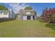 Expansive backyard with patio and private outdoor entertaining space at 1003 Dunedin Trl, Woodstock, GA 30188