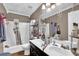 Full bathroom with double vanity, shower and tub combo, and ample storage at 1003 Dunedin Trl, Woodstock, GA 30188