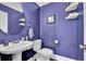 Stylish half bathroom with a modern sink and toilet at 1003 Dunedin Trl, Woodstock, GA 30188