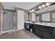 Clean bathroom with dual sinks, large vanity, and walk-in shower at 1003 Dunedin Trl, Woodstock, GA 30188