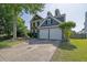 Charming two-story home with well-maintained lawn and a two-car garage at 1003 Dunedin Trl, Woodstock, GA 30188