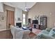 Open concept living room with a fireplace, tall ceilings, and plenty of natural light at 1003 Dunedin Trl, Woodstock, GA 30188