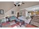 Open-concept living room connecting to the kitchen with ample seating and natural light at 1003 Dunedin Trl, Woodstock, GA 30188