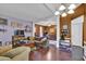 Cozy living room featuring hardwood floors, a ceiling fan, and an open layout at 1003 Dunedin Trl, Woodstock, GA 30188