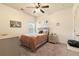 Bright bedroom featuring a ceiling fan, neutral walls, and natural light from the window at 106 Cessna Dr, Canton, GA 30114