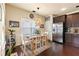 Cozy dining area with natural light, hardwood floors, stylish decor, and seating for six at 106 Cessna Dr, Canton, GA 30114