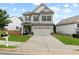 Charming two-story home with manicured lawn, covered entryway, and neutral gray tones at 106 Cessna Dr, Canton, GA 30114