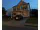 Two-story home featuring a well-maintained lawn and attached two-car garage at 106 Cessna Dr, Canton, GA 30114