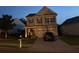 Attractive two-story home with a manicured lawn, and a convenient two-car garage at 106 Cessna Dr, Canton, GA 30114