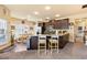 Open concept kitchen with granite counters, dark cabinets, stainless steel appliances and an eat-in area at 106 Cessna Dr, Canton, GA 30114