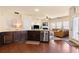 Open-concept kitchen and living room with granite counters, stainless steel appliances and a fireplace at 106 Cessna Dr, Canton, GA 30114