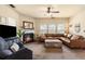 Inviting living room with cozy fireplace, plush seating, and lots of natural light from large windows at 106 Cessna Dr, Canton, GA 30114