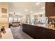 Open concept living space features a large leather sectional, granite countertop and a dining area at 106 Cessna Dr, Canton, GA 30114