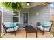 Relaxing outdoor patio with comfortable seating, a ceiling fan, and a tranquil ambiance at 106 Cessna Dr, Canton, GA 30114