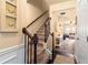 View of carpeted stairs with wood handrail and iron balusters leading to the second floor at 106 Cessna Dr, Canton, GA 30114