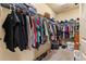 Walk-in closet with extensive shelving, hanging rods, and storage for clothing and shoes at 106 Cessna Dr, Canton, GA 30114