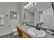Bathroom featuring a large vanity, sink, toilet, and a mirror with modern lighting at 2535 Brookgate Xing, Ellenwood, GA 30294