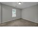 Cozy bedroom with gray walls, neutral carpet and a window at 2535 Brookgate Xing, Ellenwood, GA 30294