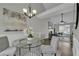 Elegant dining room with a stylish table, chandelier, and access to the living area at 2535 Brookgate Xing, Ellenwood, GA 30294
