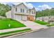 Two-story home with a well-maintained lawn and driveway leading to a two-car garage at 2535 Brookgate Xing, Ellenwood, GA 30294