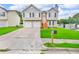Charming two-story home featuring a two-car garage and a well-manicured lawn at 2535 Brookgate Xing, Ellenwood, GA 30294