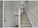 Carpeted staircase with white railings leading to the upper level of the home at 2535 Brookgate Xing, Ellenwood, GA 30294