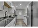 Modern kitchen with stainless steel appliances, dark countertops, and white cabinetry at 2535 Brookgate Xing, Ellenwood, GA 30294