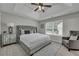 Main bedroom features tray ceiling, ceiling fan, carpet, and a decorative headboard at 2535 Brookgate Xing, Ellenwood, GA 30294