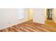 Small bedroom with wood-look floors and a closet entrance at 403 Hidden Hills Ct, Canton, GA 30115