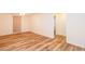 Large finished basement room with wood-look floors at 403 Hidden Hills Ct, Canton, GA 30115