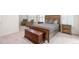 Comfortable bedroom featuring plush carpet, window shutters, and cozy seating area at 403 Hidden Hills Ct, Canton, GA 30115